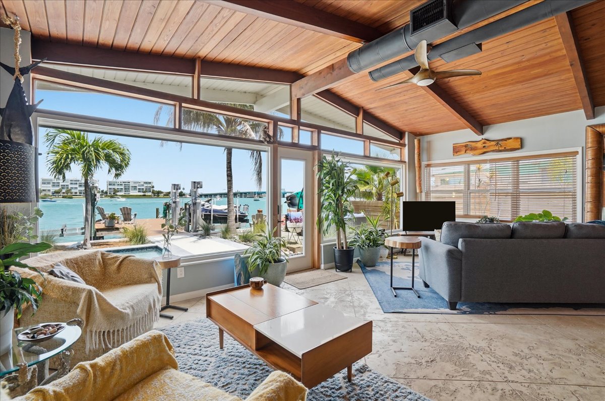 Open living room with floor-to-ceiling views of the bay